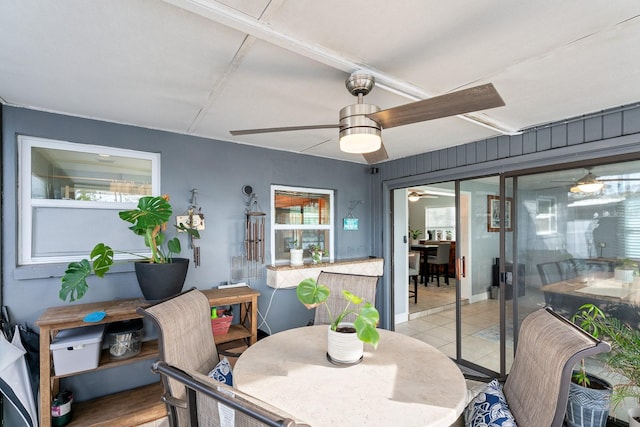 dining area with ceiling fan, plenty of natural light, and light tile patterned floors