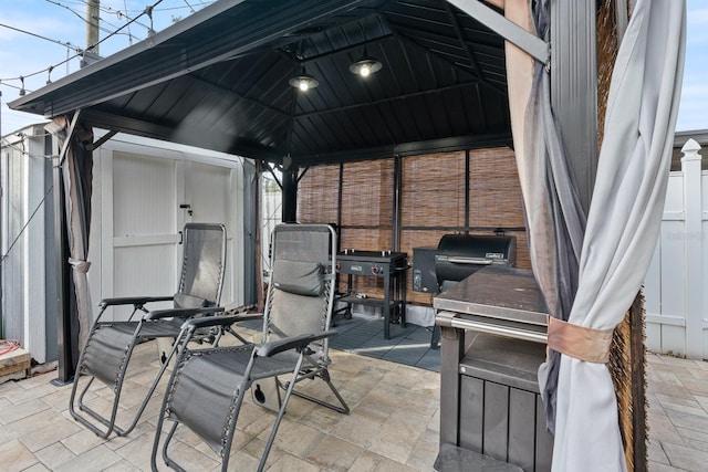 view of patio featuring a gazebo and area for grilling