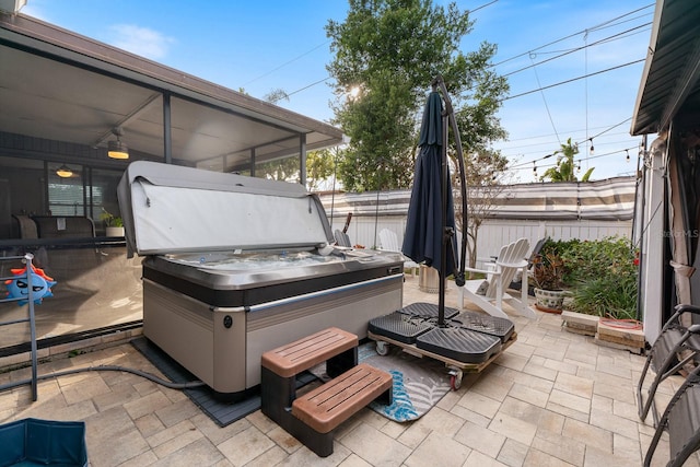 view of patio / terrace with a hot tub