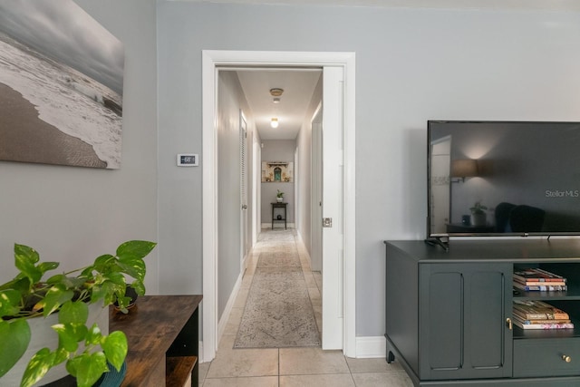 hallway with light tile patterned floors