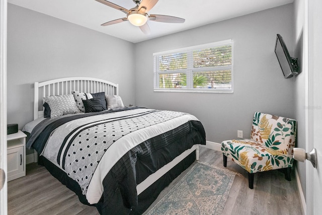 bedroom featuring wood-type flooring and ceiling fan