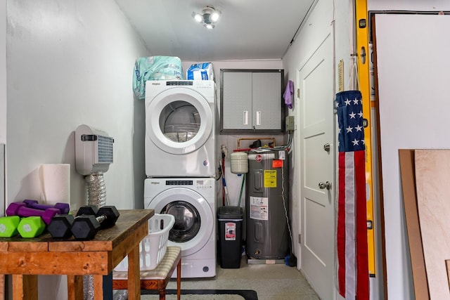 washroom featuring cabinets, stacked washer / drying machine, and water heater