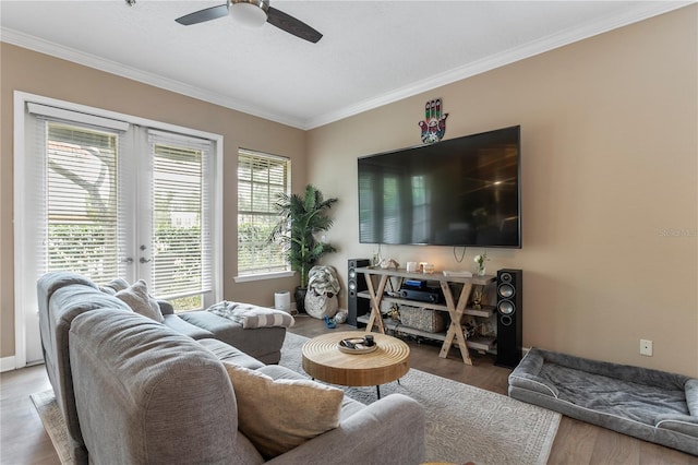 living room with ceiling fan, french doors, crown molding, and wood-type flooring