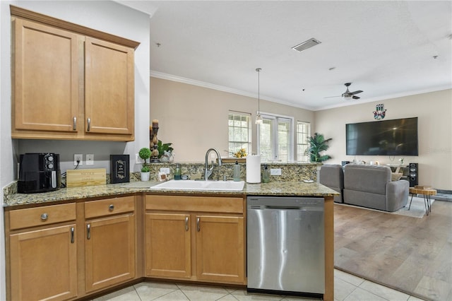 kitchen featuring dishwasher, sink, light tile patterned floors, light stone counters, and ornamental molding