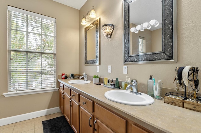 bathroom with plenty of natural light, tile patterned flooring, and vanity