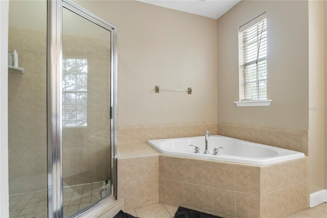 bathroom featuring separate shower and tub and tile patterned flooring