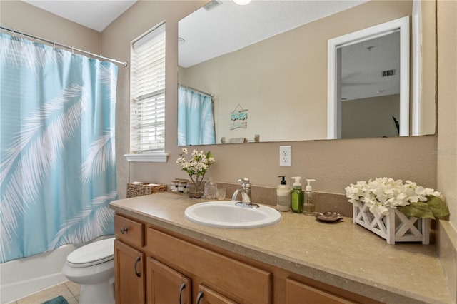 full bathroom featuring toilet, a healthy amount of sunlight, shower / bathtub combination with curtain, and tile patterned flooring