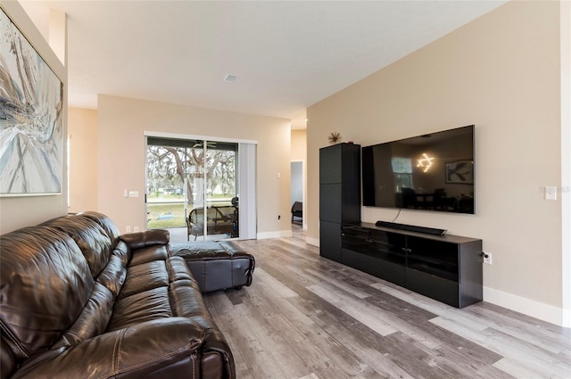 living room with light hardwood / wood-style floors