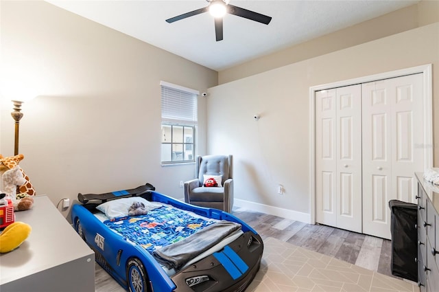 bedroom featuring a closet, ceiling fan, and light wood-type flooring