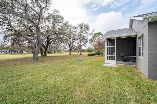 view of yard featuring a sunroom