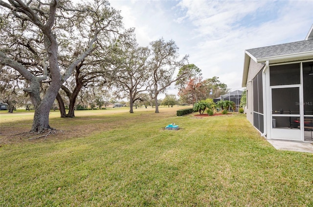 view of yard featuring a sunroom