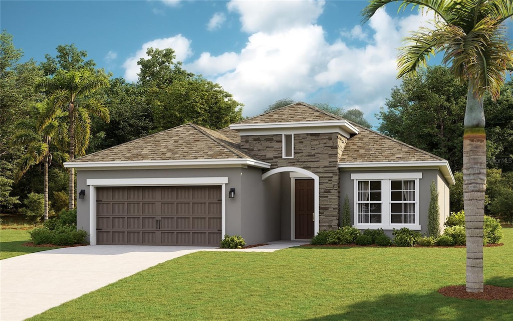 view of front facade featuring a garage and a front lawn