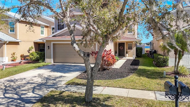 view of front of property with a garage and a front yard