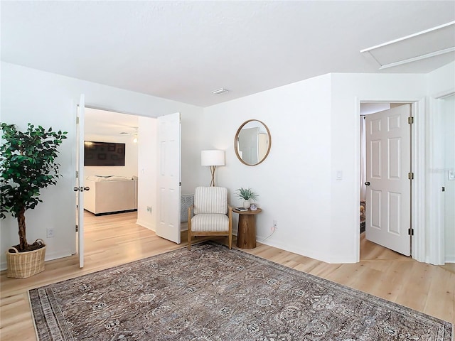 sitting room featuring light hardwood / wood-style floors