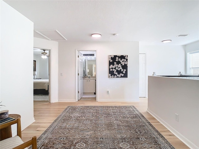 hall with light hardwood / wood-style floors