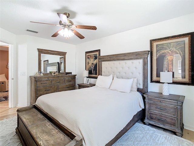 bedroom with ceiling fan and light hardwood / wood-style floors