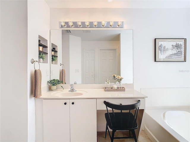 bathroom with vanity and a bathing tub