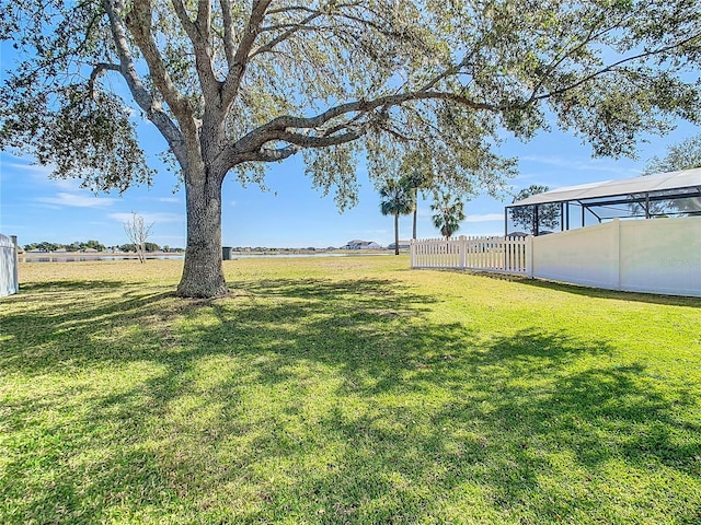 view of yard featuring a lanai