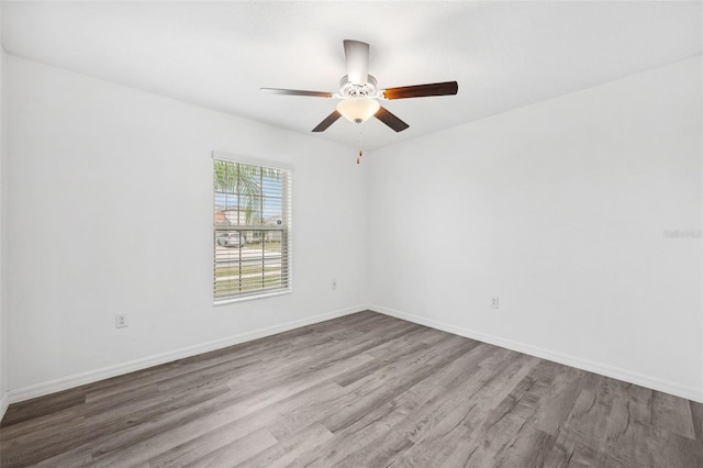 unfurnished room with light hardwood / wood-style flooring and ceiling fan