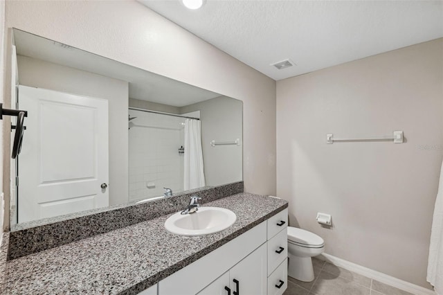 bathroom with curtained shower, a textured ceiling, tile patterned flooring, vanity, and toilet