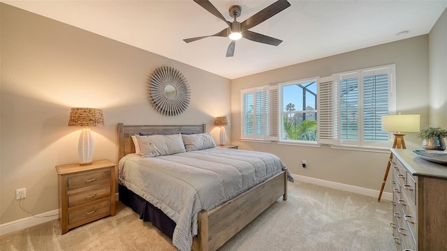 bedroom featuring ceiling fan and light colored carpet