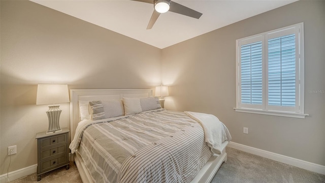 bedroom with ceiling fan and light carpet