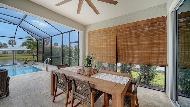 sunroom featuring ceiling fan