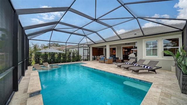 view of swimming pool with ceiling fan, an outdoor hangout area, a patio area, and glass enclosure