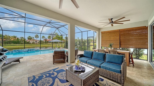 view of patio featuring pool water feature, an outdoor hangout area, ceiling fan, and glass enclosure