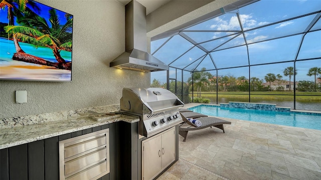 view of patio with a lanai, grilling area, exterior kitchen, pool water feature, and a water view