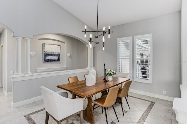 dining space featuring decorative columns