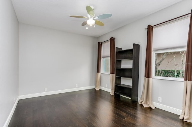 unfurnished bedroom with ceiling fan and dark hardwood / wood-style flooring