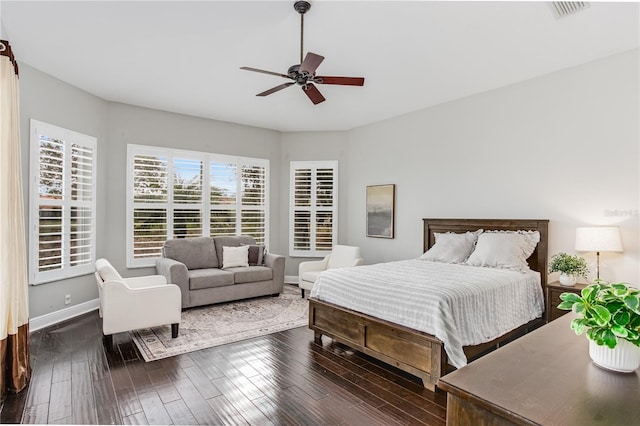 bedroom with ceiling fan and dark hardwood / wood-style flooring