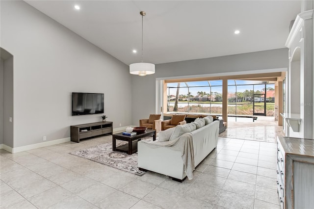 living room with plenty of natural light and light tile patterned floors