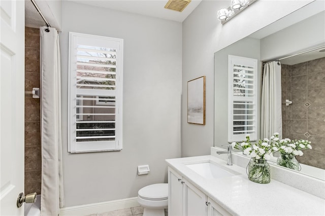 bathroom with vanity, toilet, tile patterned floors, and a shower with shower curtain