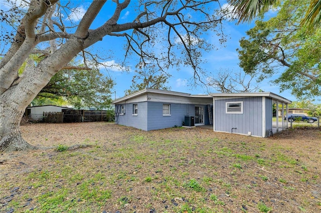 rear view of property with central air condition unit