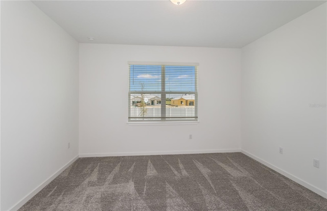 6805 SW 90th Loop, Ocala, FL 34476 - spare room featuring baseboards and carpet floors