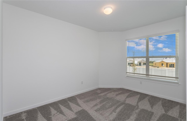6805 SW 90th Loop, Ocala, FL 34476 - unfurnished room with baseboards and carpet flooring