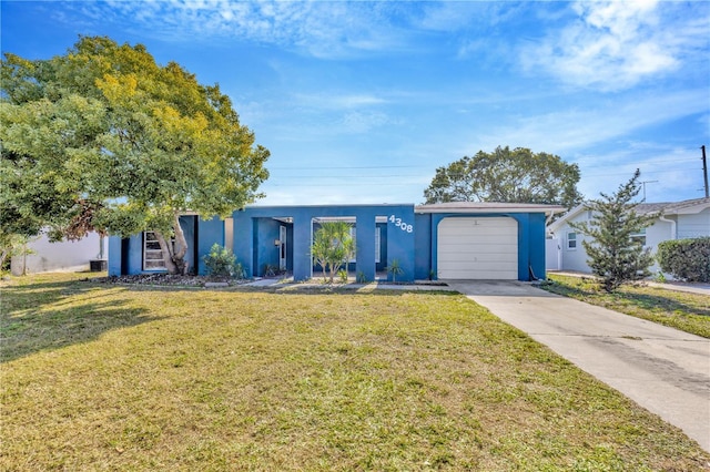 ranch-style home with a front yard and a garage