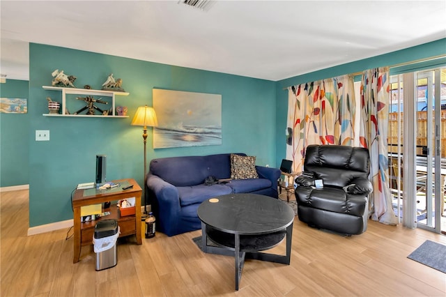 living room with light hardwood / wood-style flooring