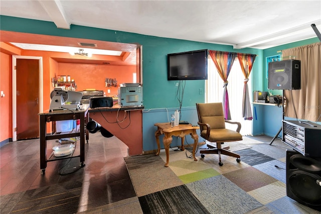 living room featuring beam ceiling