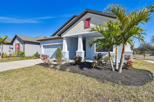 view of front facade with a garage and a front lawn