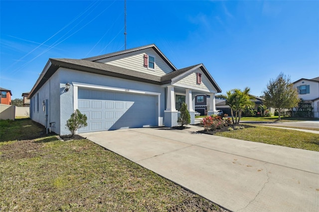 view of front of home with a garage and a front yard