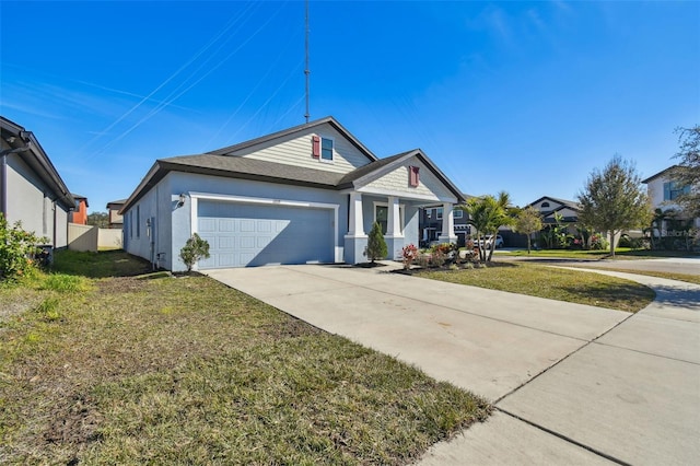 view of front of house with a garage and a front lawn