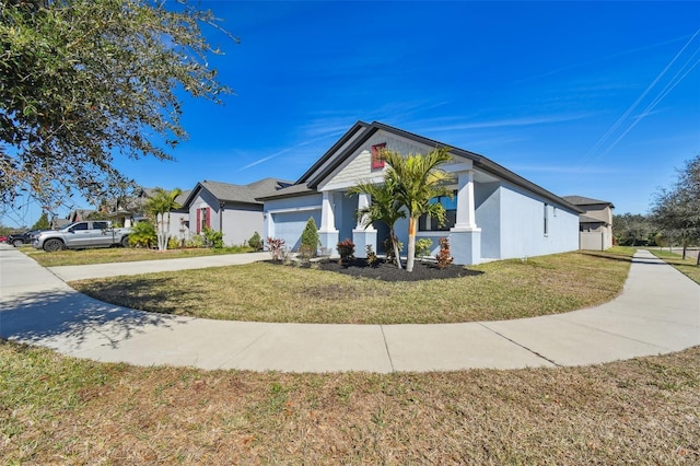 view of front of home featuring a garage and a front yard