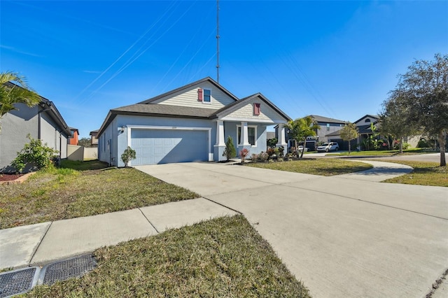 view of front facade with a garage and a front lawn