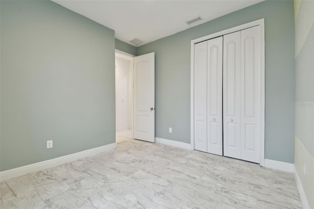 unfurnished bedroom featuring a closet