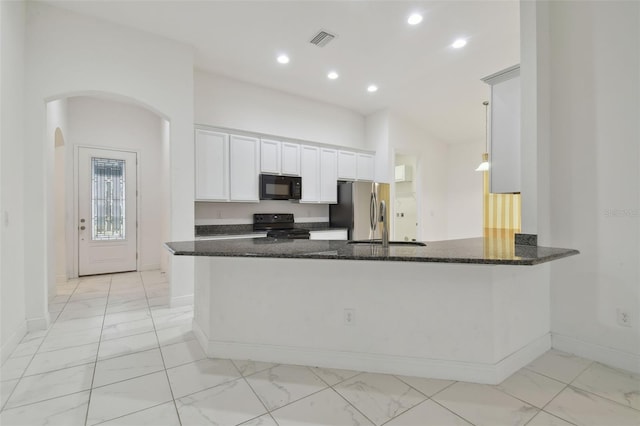 kitchen with white cabinetry, kitchen peninsula, dark stone counters, and black appliances