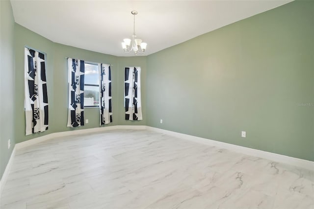 empty room featuring an inviting chandelier