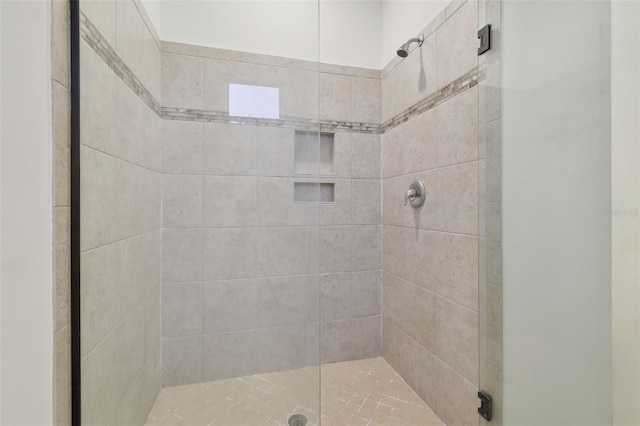 bathroom with a shower with shower door